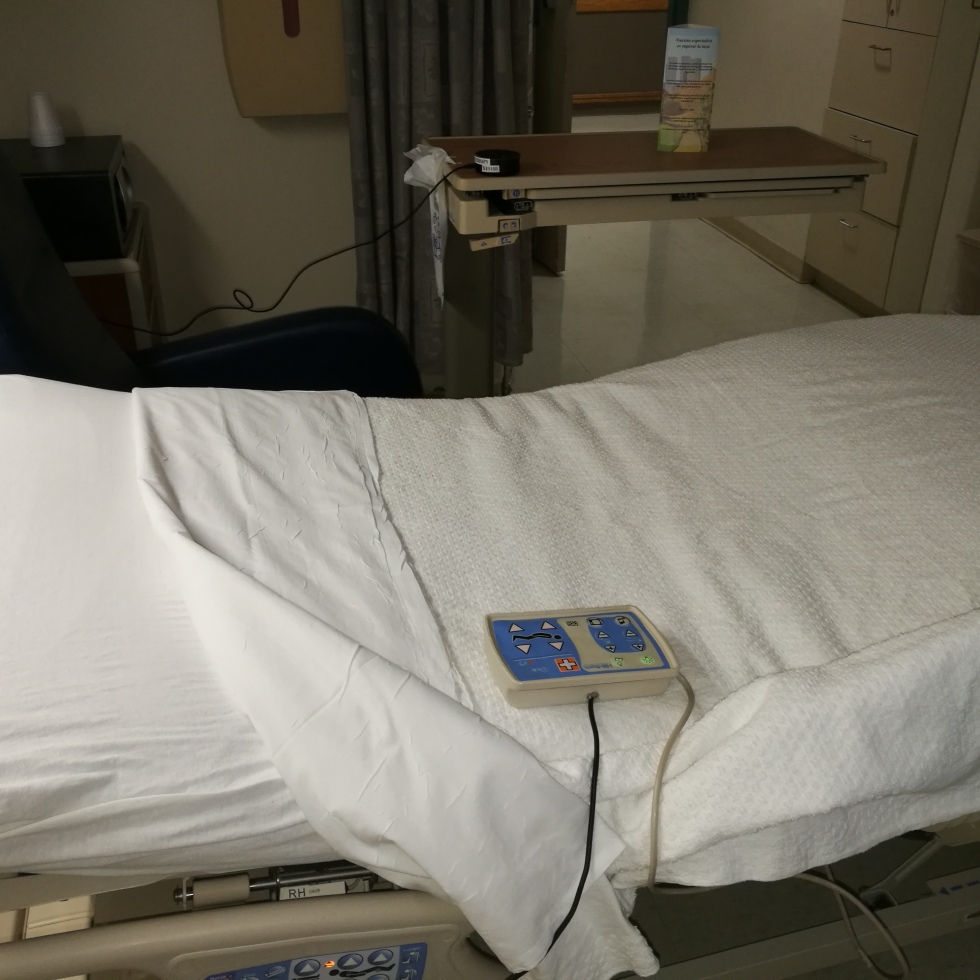 voice activated hospital bed pendant on bed